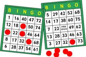 Two bingo cards with green borders and the word "BINGO" in yellow at the top. The left card has several red markers on the numbers: 12, 22, 32, 46, and 50. The right card has a "FREE SPACE" in the center and red markers on the numbers: 7, 32, and 73. There are additional red markers scattered around the cards.