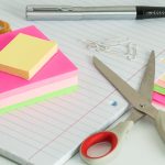colourful post it notes next to a pair of scissors