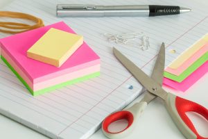 colourful post it notes next to a pair of scissors